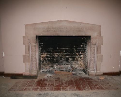 A Stone Oven Next To A Fireplace